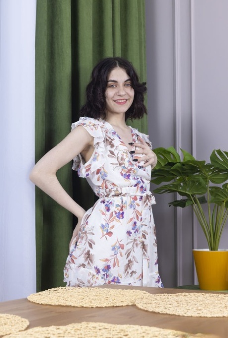 Charming brunette teen Regina gets totally naked in a tempting manner