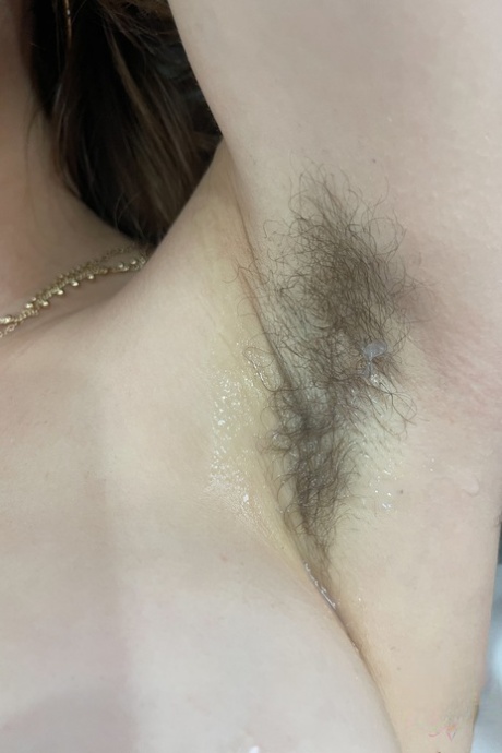 Amateur Fiona Sprouts shows her tits & hairy armpits & spreads her bald cunt