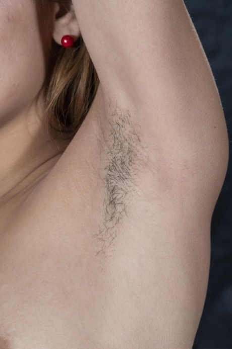 Skinny redhead Clarita gives arousing up-close views of her hairy pussy