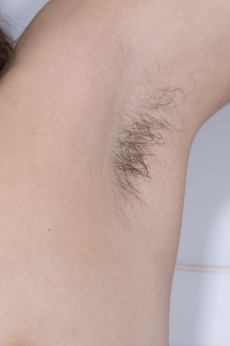 Curvy babe Tiffany spreads her hairy pussy up close during a sexy striptease