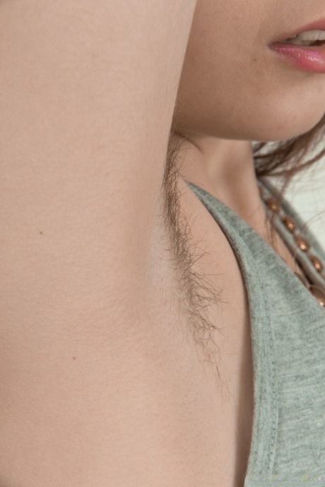 Amateur teen Amelia doffs her clothes to rub her hairy vagina in a solo