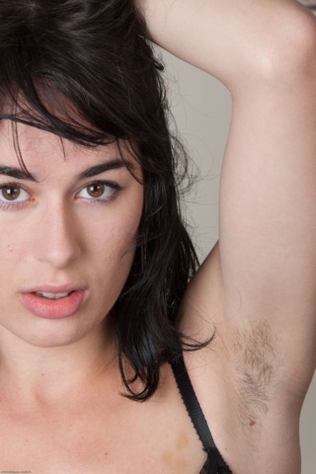 Brunette amateur Olive strips naked and shows her big ass & hairy twat